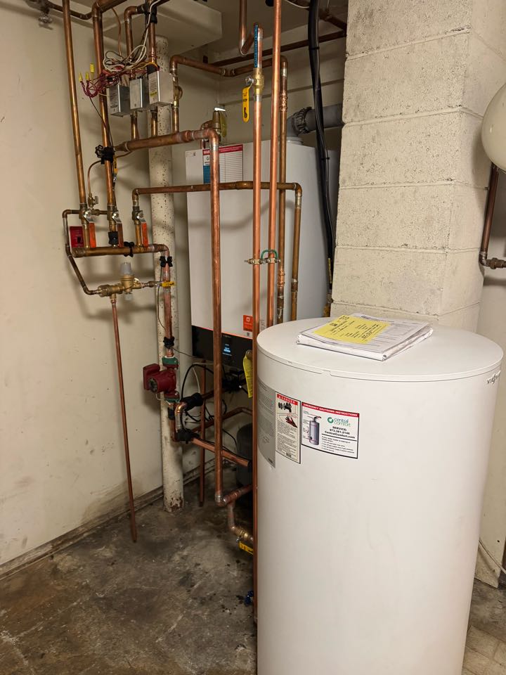 A  natural gas conversion of a high efficiency, Viessmann boiler and indirect water heater.