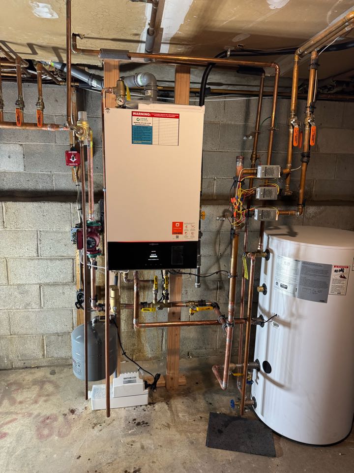 Oil to natural gas conversion of a high efficiency Viessmann hot water boiler and indirect water heater. 