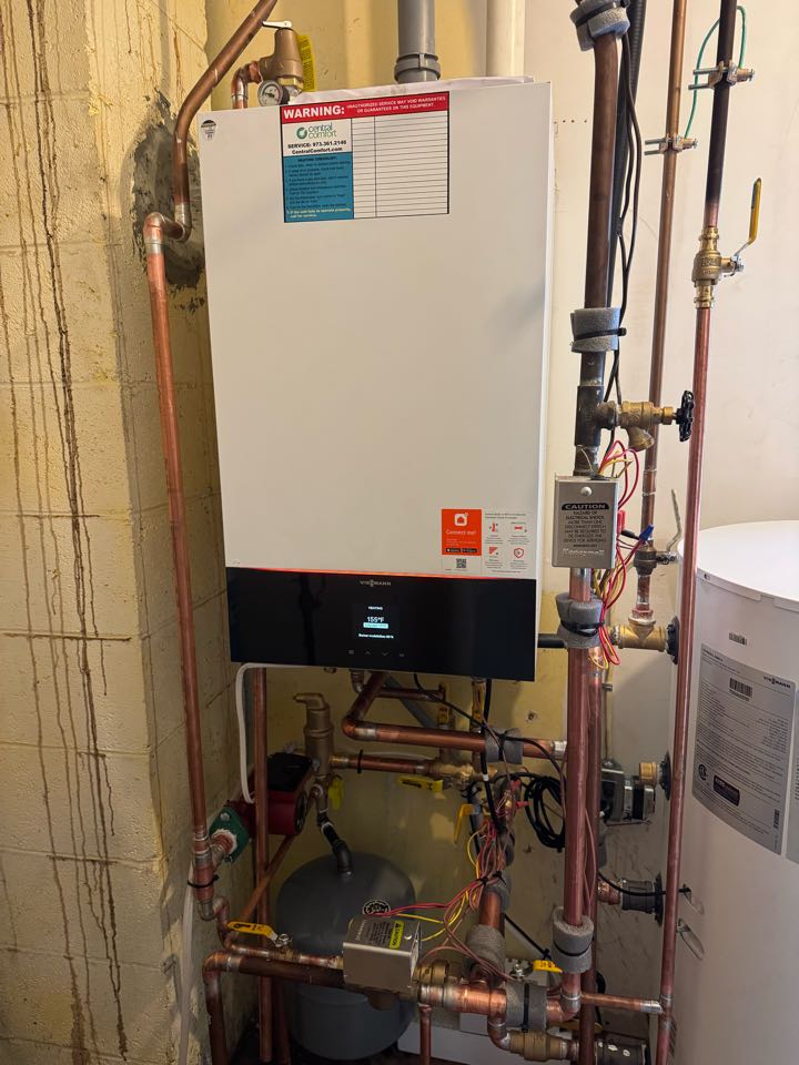 Oil to natural gas conversion of a high efficiency, Viessmann boiler, and indirect water heater.