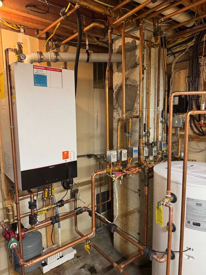 Oil to natural gas conversion of a high-efficiency Viessmann boiler and indirect water heater.