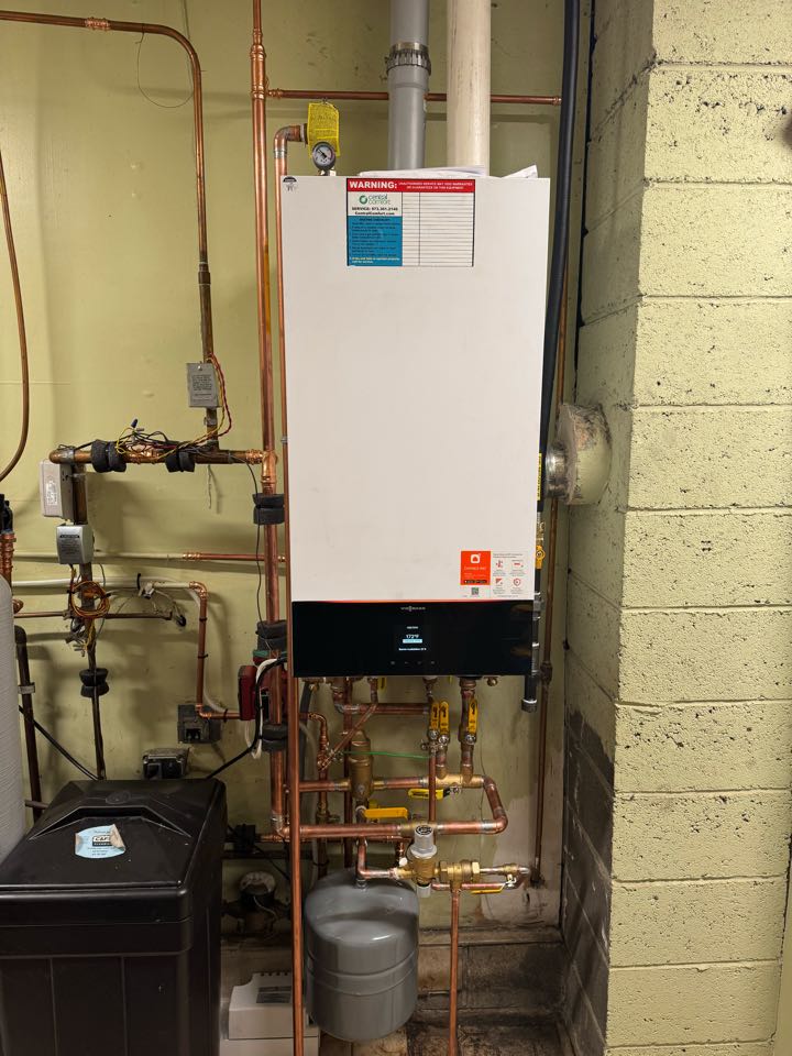 An oil to natural gas conversion of a high efficiency Viessmann combi hot water boiler. 