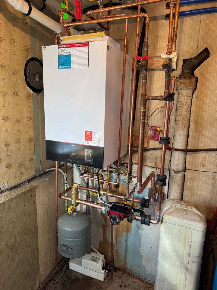 Oil to natural gas conversion of a high-efficiency Viessmann boiler and indirect water heater Combi unit.