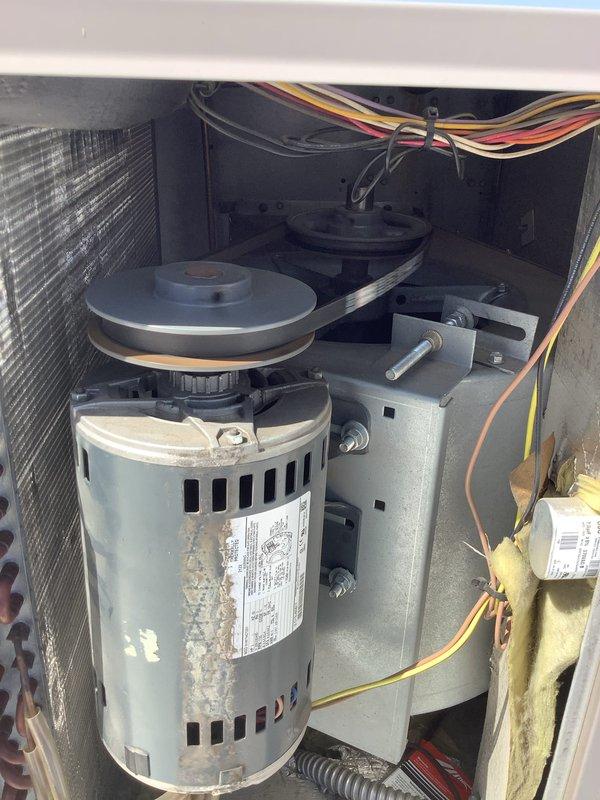 Completed Comfort Care Plan maintenance visit on multiple HVAC systems totaling nine units. Performed comprehensive inspections including examination of blower motor assemblies, belt drive systems, and air filtration components. Documented equipment conditions with photos showing operational motors with proper pulley alignment, clean PerfectPleat filters in place, and verified electrical connections throughout all units inspected.