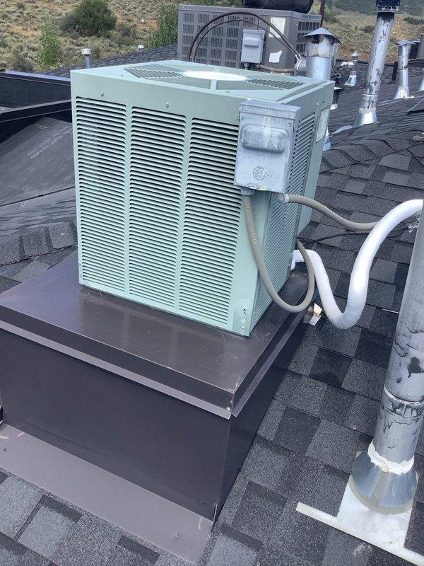 Responded to service call for air conditioning system not cooling properly with possible thermostat issues. Accessed rooftop-mounted condenser unit using extension ladder as required for elevated installation on composition shingle roof. Performed comprehensive Cool 5-9 preventive maintenance inspection on split system HVAC equipment including rooftop condenser and indoor air handler unit located in mechanical room.

Inspected condenser unit mounted on raised platform with insulated refrigerant lines. Checked refrigerant line connections, verified proper insulation on suction and liquid lines, and assessed overall equipment condition. Evaluated condenser coil cleanliness and airflow through louvered panels. Confirmed condenser fan operation and assessed compressor performance.

Proceeded to interior mechanical room to inspect air handler unit with visible internal components through transparent access panel. Examined refrigerant line connections at air handler, verified proper mounting