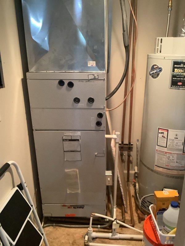 Responded to service call for air conditioning system not cooling properly with possible thermostat issues. Accessed rooftop-mounted condenser unit using extension ladder as required for elevated installation on composition shingle roof. Performed comprehensive Cool 5-9 preventive maintenance inspection on split system HVAC equipment including rooftop condenser and indoor air handler unit located in mechanical room.

Inspected condenser unit mounted on raised platform with insulated refrigerant lines. Checked refrigerant line connections, verified proper insulation on suction and liquid lines, and assessed overall equipment condition. Evaluated condenser coil cleanliness and airflow through louvered panels. Confirmed condenser fan operation and assessed compressor performance.

Proceeded to interior mechanical room to inspect air handler unit with visible internal components through transparent access panel. Examined refrigerant line connections at air handler, verified proper mounting