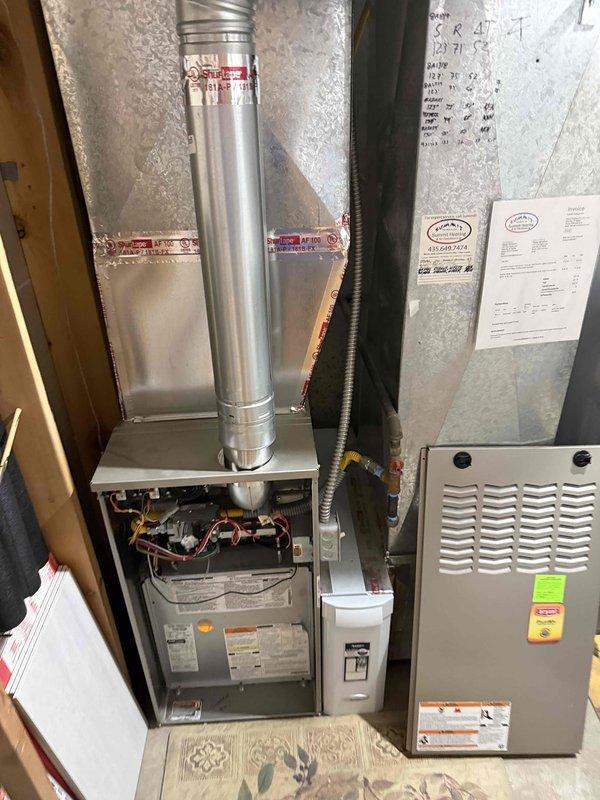 Conducted comprehensive evaluation of residential property with no existing air conditioning system to provide replacement estimate. Inspected existing gas furnace installation in utility closet, assessed current ductwork infrastructure including galvanized metal distribution system in attic space, and verified compatibility for new HVAC equipment installation. Documented existing mechanical components, duct configuration, and available space to develop complete system replacement proposal for central air conditioning integration with current heating system.