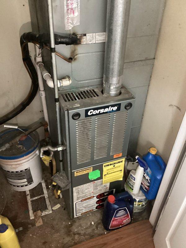 Responded to service call regarding HVAC system malfunction following water heater installation by plumber. Upon arrival, found disconnected electrical wiring at furnace location where plumbing work had been performed. Inspected Corsaire furnace unit and associated components in utility area, identifying improperly reconnected switch wiring with exposed wire nuts and loose connections at junction box. Restored proper electrical connections, secured all wiring to code, and tested system operation to verify furnace functionality. System returned to normal operation with all safety switches functioning correctly.