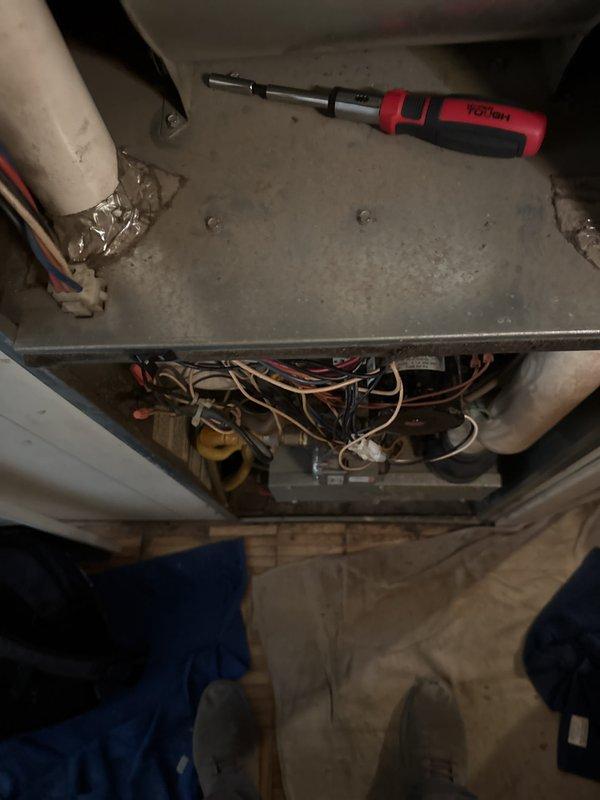 Responded to service tech referral for troubleshooting electrical issue on aging furnace system. Conducted thorough diagnostic inspection of furnace electrical components and wiring systems, accessing internal compartments to trace and identify source of intermittent electrical fault. Documented existing equipment configuration and measured copper refrigerant lines during assessment. Property currently utilizes evaporative cooling system with no central air conditioning present.