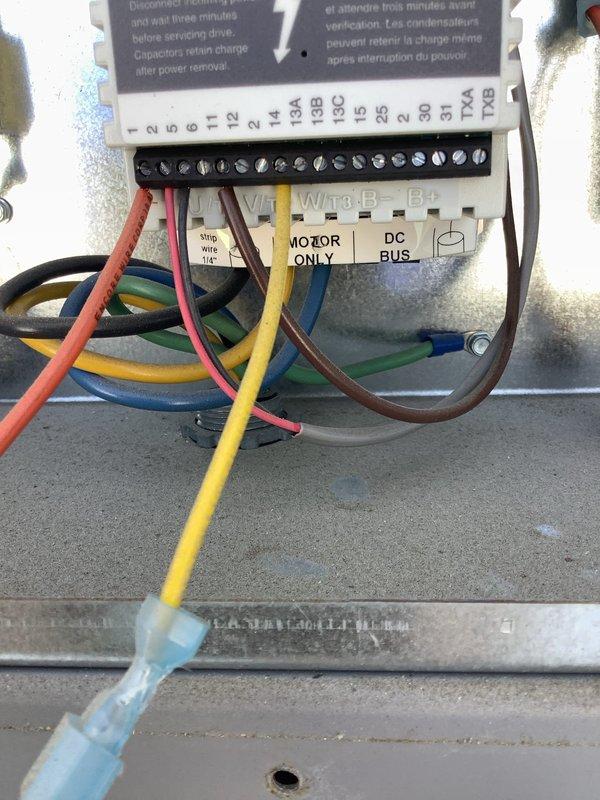 Responded to callback for non-operational HVAC unit. Upon arrival, performed diagnostic inspection of equipment and electrical components. Inspected blower motor assembly, pulley system, and belt drive mechanism for proper operation and alignment. Verified all electrical connections at terminal block, checking wire terminations and control circuit integrity. Examined refrigerant line installation and mounting brackets for secure positioning. Documented equipment condition with photos showing control panel wiring, terminal connections, and mechanical components in confined space installation. All systems tested and restored to normal operation.