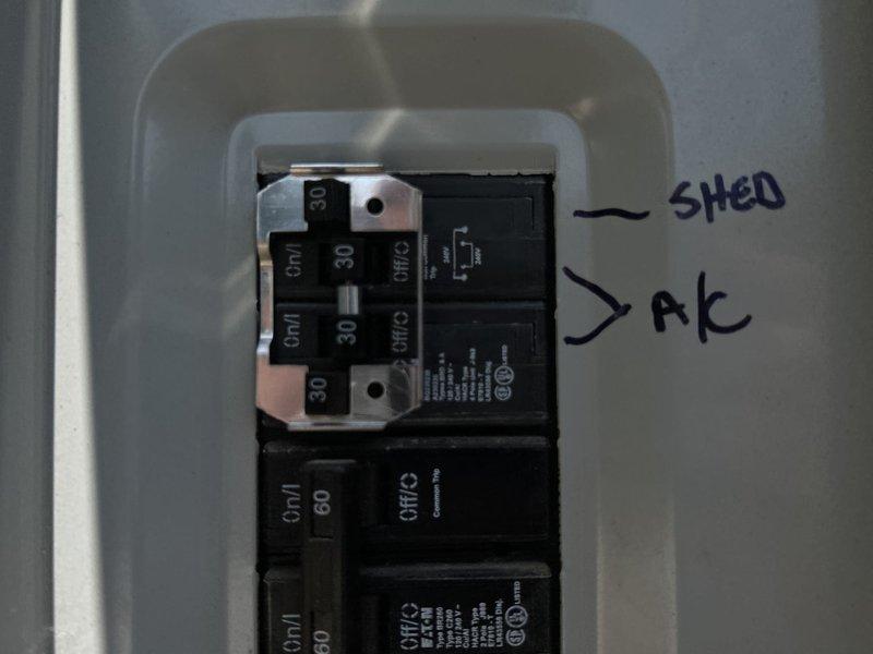 Responded to service technician referral for locked compressor that could not be repaired with hard start kit or field repairs. Inspected electrical panel and circuit breakers serving the air conditioning system, documenting 30-amp and 60-amp breaker configuration and circuit labeling. Photographed electrical distribution setup showing properly seated breakers and bus bar connections in preparation for system replacement estimate.