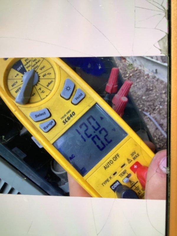 Responded to no cooling complaint on R-22 system. Upon arrival, confirmed unit was not operating. Performed diagnostic evaluation and obtained refrigerant side measurements using digital gauges. Suction pressure measured 74.3 PSIG with suction line temperature at 58.4°F, resulting in 16.0°F superheat at 42.4°F saturation temperature. Liquid line pressure recorded at 180.0 PSIG with line temperature of 91.9°F, showing critically low subcooling of 1.7°F at 93.6°F saturation temperature. Verified supply voltage at 122.62 VAC using multimeter. Low subcooling reading indicates significant refrigerant undercharge in system. Documented all measurements and electrical readings with photos for customer records.