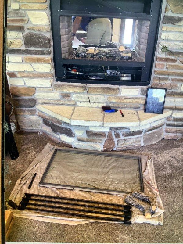 Responded to service call for gas fireplace with pilot light and ignition failure. Upon arrival, removed fireplace door assembly to access burner compartment and control components. Performed diagnostic testing using clamp meter to verify electrical continuity and proper voltage to ignition system. Identified faulty pilot assembly preventing ignition. Cleaned pilot orifice, tested thermopile output, and verified gas valve operation. Reassembled fireplace door and confirmed proper ignition sequence and flame operation before completing service.