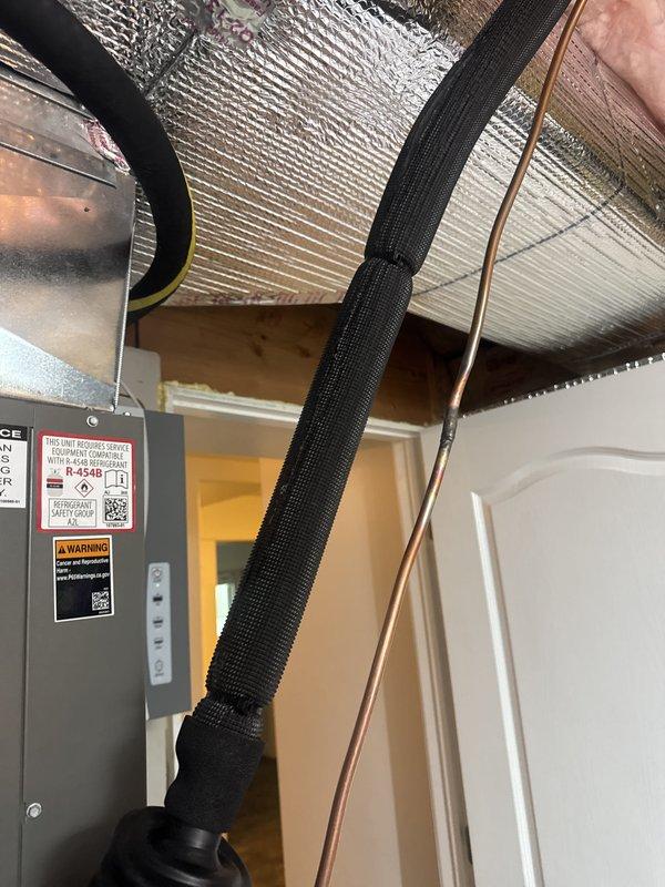 Completed full HVAC system installation including SLP99UH090XV48CK furnace, CK40CT-48C coil, SL25KCV-048 condenser unit, and S40 thermostat. Installed eight zone dampers (six 22v25 units and two 22v26 units) with communicating control panel. All refrigerant lines properly routed through attic space with insulation sleeves, air handler mounted and secured in attic with proper clearances, and electrical disconnect box installed on exterior wall with fused safety switch. System tested and operational with two-year CCP coverage activated.