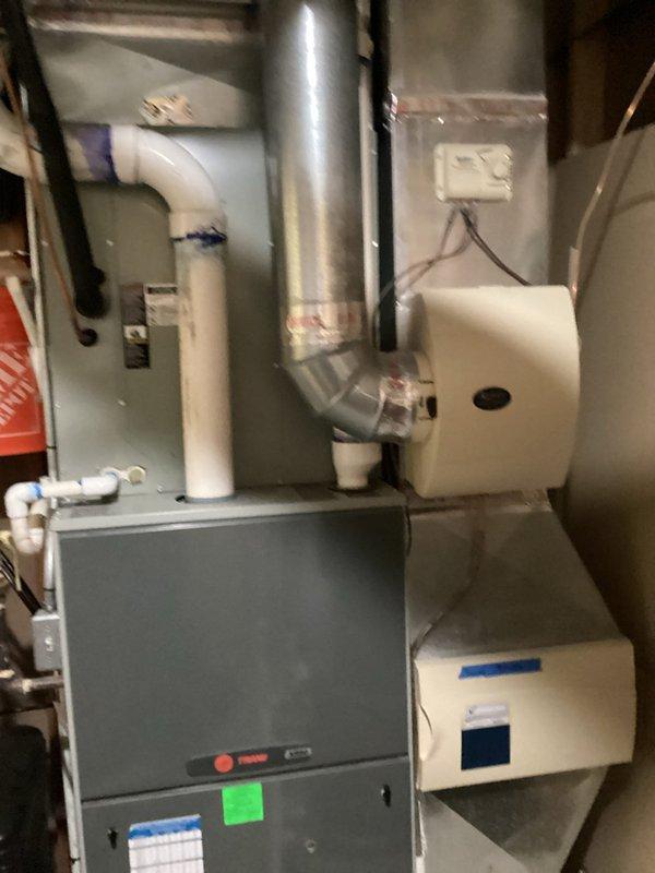 Conducted HVAC system assessment and estimate for aging 20-year-old R22 residential system referred by service technician. System currently operational but nearing end of service life. Documented existing equipment configuration including furnace installation in mechanical room with associated ductwork, humidifier unit, PVC condensate drain/vent piping, and electrical connections. Photographed electrical panel to verify circuit capacity and existing HVAC electrical infrastructure for future replacement planning. Provided technical consultation regarding system replacement options given R22 refrigerant phase-out and equipment age considerations.