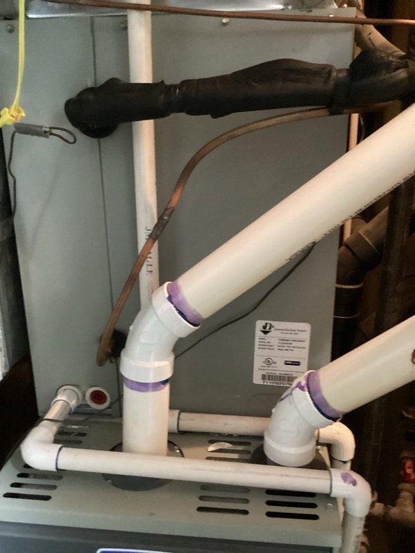Conducted technical assessment and estimate for dual HVAC system replacement at residential property where existing furnaces were previously diagnosed with heat exchanger failures by another contractor. Documented model and serial numbers of both indoor furnace units and outdoor condensing units through comprehensive photography for potential repair consideration. Photographed internal components including condensate drainage system with PVC piping configuration, electrical connections, and copper refrigerant lines, as well as exterior dual condenser units mounted on concrete pad to provide complete system evaluation for replacement estimate comparison.
