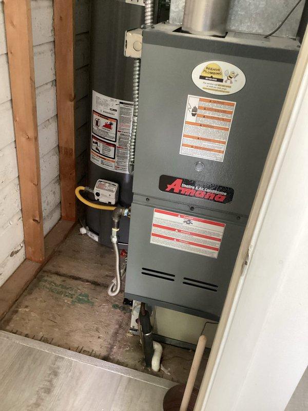 Responded to cooling complaint with 12-degree temperature differential between setpoint and actual indoor temperature. Performed diagnostic evaluation on 25+ year old split system with outdoor condensing unit and indoor furnace/air handler located in kitchen closet. Upon inspection, documented equipment age, configuration, and current operating conditions. Provided diagnostic findings and presented repair options to address inadequate cooling performance.