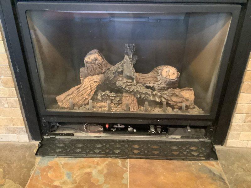 Responded to service call for two 22-year-old Napoleon gas fireplace units that were not turning on and had not functioned since homeowner purchased property. Inspected both units located in upstairs and downstairs TV rooms. Evaluated gas supply lines, ignition systems, pilot assemblies, thermopile/thermocouples, gas valves, and control modules on both fireplaces. Tested electrical connections and verified proper venting. Identified failed components preventing ignition and provided recommendations for necessary repairs to restore both units to operational status.