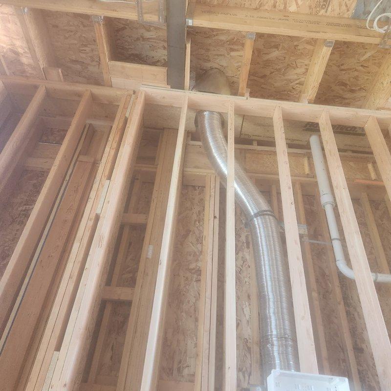 Uninstalled and removed venting system for second floor fireplace unit that was cancelled by customer. Disconnected flexible metal ductwork from framing structure, removed all associated ventilation components, and cleared work area of materials.