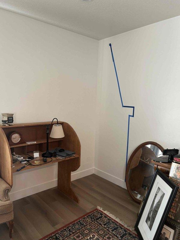 Conducted on-site assessment for gas fireplace installation in newly purchased home. Property currently lacks natural gas service, requiring coordination with utility provider for new gas line installation to residence. Evaluated proposed installation location in southeast corner of great room, documented existing conditions including wall construction and available space, and identified exterior wall penetration point for future gas line and venting requirements.