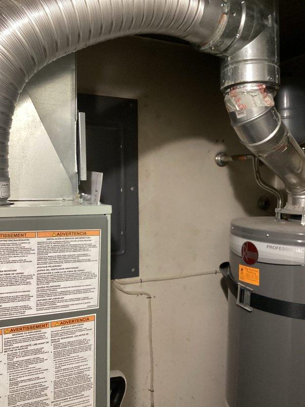 Performed comprehensive assessment of aging 16-year-old furnace system experiencing motor failure following previous repair history. Documented existing HVAC equipment configuration including furnace unit, flexible aluminum ductwork, and wall-mounted thermostat with digital display and battery backup. Provided replacement estimate for complete system upgrade due to cumulative repair costs and declining equipment reliability.
