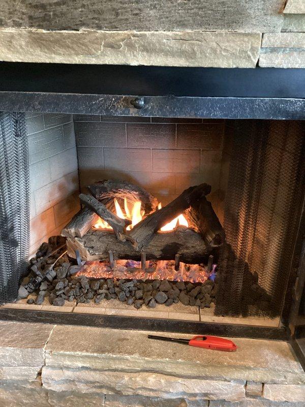 Responded to service call for two non-functioning gas fireplaces located on main floor and basement of residence, both units approximately 10-12 years old. Upon inspection, diagnosed ignition system failures on both appliances. Performed troubleshooting procedures, cleaned pilot assemblies, inspected gas valve operation, and verified proper gas flow to burners. Restored functionality to both fireplaces, confirmed successful ignition sequences, and verified flame patterns and safety controls were operating within manufacturer specifications. Both units tested and left in proper working condition.