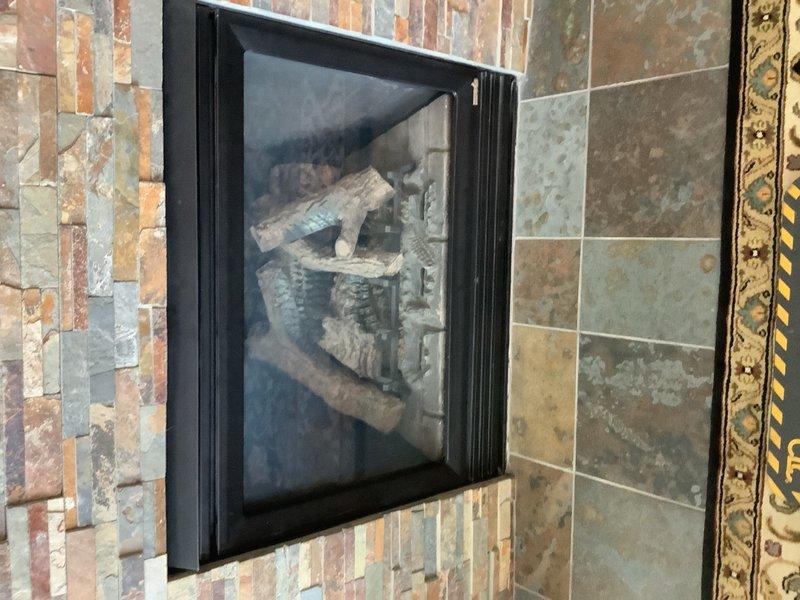 Responded to service call for gas fireplace insert repair. Accessed internal mechanical compartment and inspected gas control valve assembly, wiring connections, and pilot system components. Performed diagnostic evaluation and leveling check of control unit to ensure proper operation of the wall-mounted gas insert.
