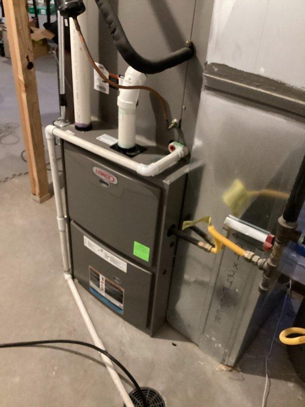 Completed annual Comfort Care Plan cooling maintenance on an 8-year-old Lennox air conditioning system with no reported issues. Performed comprehensive tune-up on single AC unit including condenser inspection on exterior left side and indoor air handler evaluation in basement mechanical room. All system components inspected, tested, and found operating within normal parameters with routine maintenance procedures completed per manufacturer specifications.