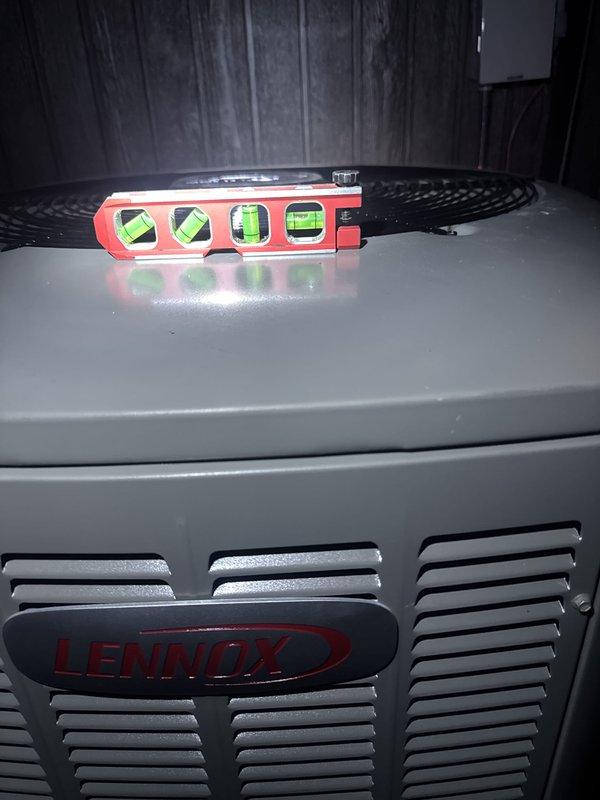 Completed full HVAC system installation including Lennox EL297UH070XV36BK high-efficiency gas furnace, CK40CT-30/36B evaporator coil, EL18KCV-036-230 outdoor condensing unit, and S40 smart thermostat. Verified proper unit placement and leveling of outdoor equipment against exterior wall, ensured adequate clearances for airflow and service access, and confirmed all components are operating within manufacturer specifications.
