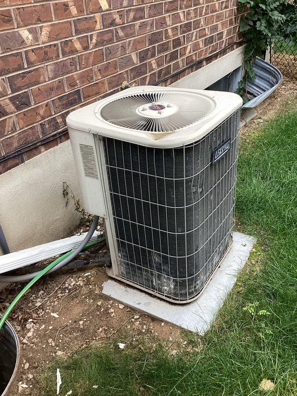 Completed comprehensive heating and cooling maintenance on a 6-9 year old residential HVAC system. Performed furnace tune-up including inspection of outdoor condenser unit, which showed normal wear and age-related dirt accumulation on lower grille and coils. Removed and replaced defective flame sensor rod with ceramic insulators that had failed. System tested and returned to proper operation.