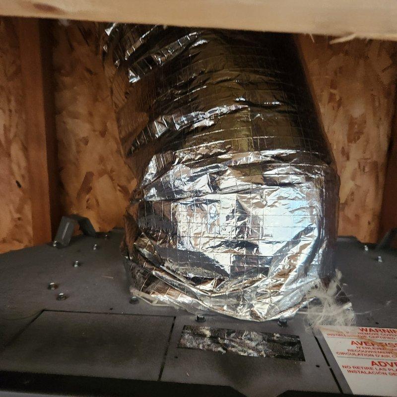 Completed installation of BX42NTRE fireplace unit with PRPX42 components. Installed flexible ductwork through attic space, routing ventilation between structural joists and securing all connections to manufacturer specifications. Verified proper clearances from combustible materials and confirmed all safety labels and warnings are visible and intact per code requirements.