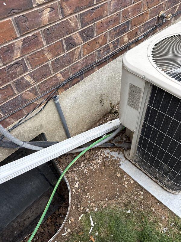 Conducted comprehensive equipment evaluation and estimate consultation for residential HVAC system replacement. Assessed aging 23-year-old Lennox air conditioning condenser unit located in exterior equipment well and 7-year-old Trane XV80 furnace with existing gas line configuration. Documented current system conditions through detailed photography, noting outdoor unit placement on concrete pad with refrigerant line routing and indoor furnace installation in utility closet with yellow gas piping. Discussed system replacement options and financing availability in preparation for anticipated equipment failure and upcoming price increases.