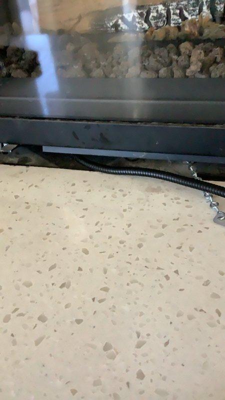 Responded to service call for 5-year-old gas fireplace with recurring faint gas odor concerns. Performed comprehensive safety inspection of gas fireplace system including visual examination of gas supply lines, connections, and venting components. Conducted leak detection testing at all gas connection points using appropriate detection methods to identify potential gas leaks. Inspected fireplace burner assembly, pilot light system, and gas valve operation for proper function and safety compliance. Examined venting system and flue for proper draft and clearance, checking for blockages or deterioration that could affect combustion air flow. Assessed firebox condition, logs, and ember bed placement for proper configuration. Verified all safety controls including oxygen depletion sensor and flame sensing devices were functioning correctly. Checked for proper gas pressure at appliance and confirmed manufacturer specifications were met. Inspected flexible gas connector and shutoff valve acce