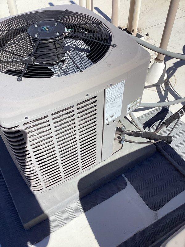 Conducted on-site assessment of existing HVAC system for equipment replacement estimate. Inspected rooftop condenser unit showing signs of wear and evaluated indoor air handler components to determine full system replacement requirements following previous compressor failure diagnosis.