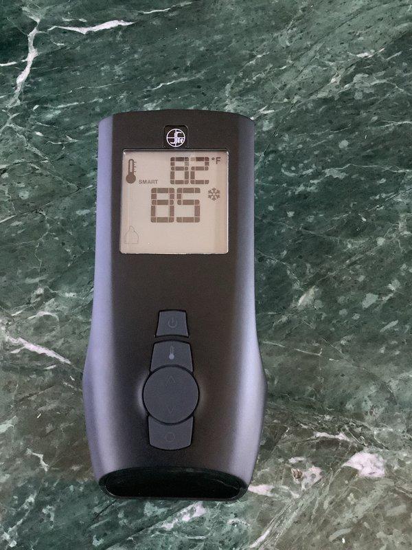Responded to warranty call for gas fireplace with ignition failure following previous service. Upon arrival, inspected burner assembly, pilot system, and gas valve operation. Verified proper gas supply and pressure at unit. Examined artificial log placement and confirmed proper positioning to allow adequate airflow and flame pattern. Tested thermopile output readings, measuring 82°F at primary sensor with ambient temperature at 85°F, indicating potential thermocouple or thermopile weakness affecting pilot safety system. Checked all electrical connections to ignition module and verified proper grounding. Inspected for blockages in burner ports and pilot orifice. Given history of multiple previous repairs, recommended further diagnostic testing of gas valve and complete pilot assembly replacement to resolve recurring ignition issues and restore reliable operation.