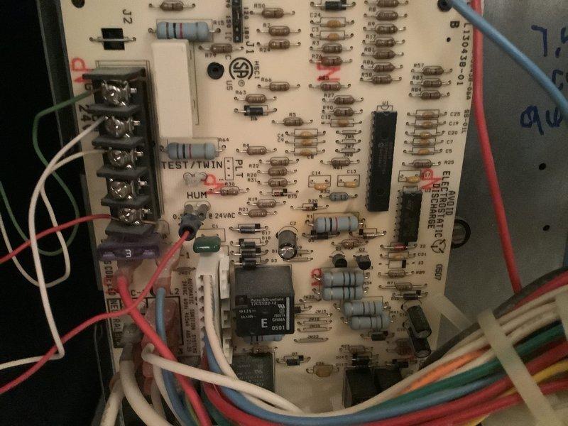Completed preventative maintenance tune-up on 21-year-old HVAC system located in hallway. Performed comprehensive inspection of air handler unit, which showed significant dust accumulation on ductwork and casing surfaces requiring attention. Inspected control board and electrical connections, verifying proper operation of all relays, capacitors, and integrated circuits. All wire terminations at terminal blocks were secure with no signs of overheating or damage. System tested and operating within normal parameters with no reported issues from customer prior to service.