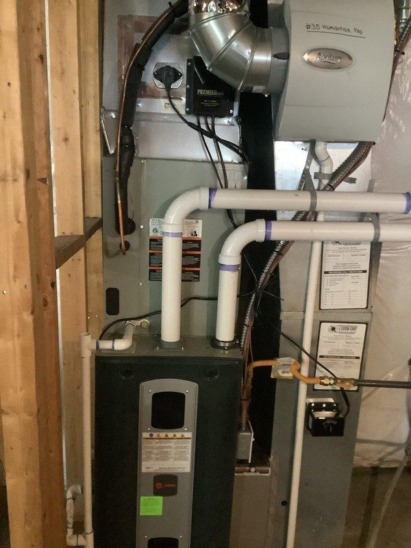 Completed annual maintenance on 4-year-old furnace system located in basement with integrated Aprilaire humidifier. Addressed customer concern regarding intermittent noise from blower motor at startup. Performed comprehensive tune-up including inspection of heat exchanger, burner assembly, and ignition system. Verified proper operation of all safety controls and limit switches. Checked and tested humidifier functionality and water supply connections. Inspected PVC venting system and condensate drain lines for proper pitch and drainage. Tested blower motor operation and amp draw, monitored for abnormal sounds during multiple cycles with no issues detected. Verified all electrical connections secure and proper voltage to unit. System operating within manufacturer specifications upon completion.