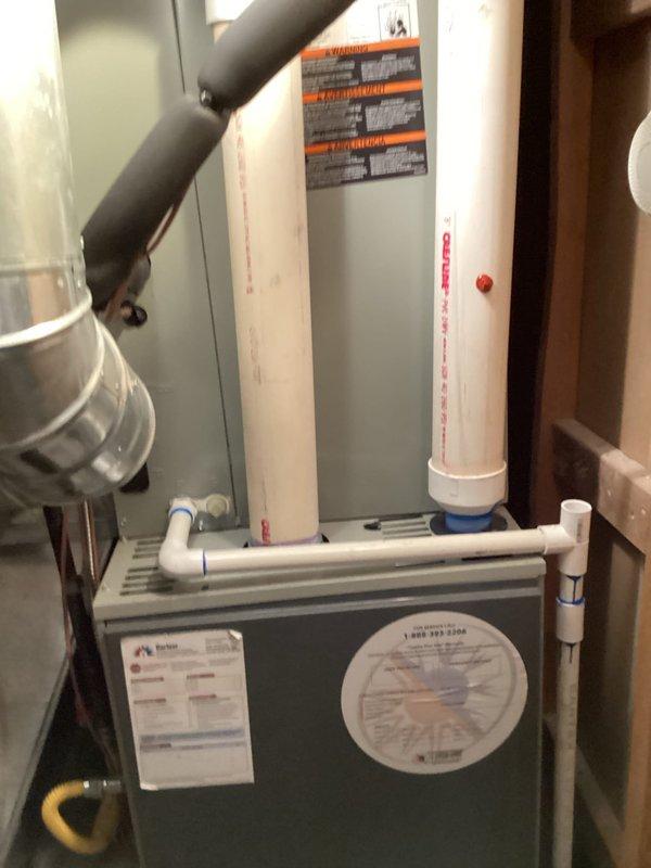 Completed routine maintenance and tune-up on residential furnace and gas fireplace system. Inspected furnace unit including heat exchanger, burner assembly, and ignition components. Verified proper operation of all safety controls and limit switches. Checked and documented combustion air intake and exhaust venting through PVC piping system. Inspected Aprilaire humidification system for proper function and water supply connections. Evaluated ductwork connections and verified secure mounting of main supply plenum. Tested blower motor operation and inspected electrical connections at unit. Performed fireplace inspection including pilot assembly, gas valve operation, and venting system integrity. Both heating systems operating within manufacturer specifications with no deficiencies noted. All equipment confirmed functional and ready for heating season operation.