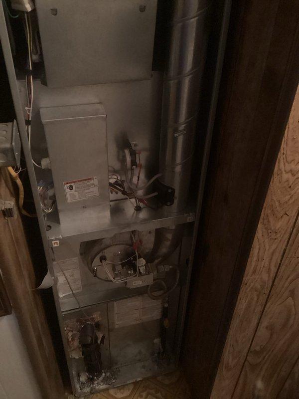 Completed annual heating maintenance on a 6-year-old gas furnace located on the main floor. Performed comprehensive system inspection including blower motor assembly, ductwork connections, and all internal components. No issues were reported by the customer and unit was found to be operating within normal parameters. Verified proper airflow through cylindrical metal flue pipe and checked all electrical connections and wiring. System tested and confirmed operational for the heating season.