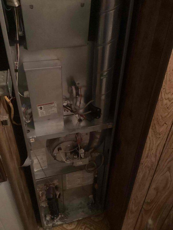 Completed annual heating maintenance on a 6-year-old gas furnace located on the main floor. Performed comprehensive system inspection including blower motor assembly, ductwork connections, and all internal components. No issues were reported by the customer and unit was found to be operating within normal parameters. Verified proper airflow through cylindrical metal flue pipe and checked all electrical connections and wiring. System tested and confirmed operational for the heating season.