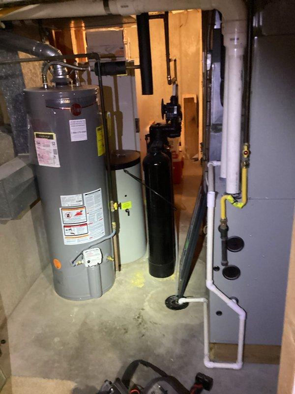 Completed fall maintenance tune-up on furnace system and fireplace maintenance as part of recurring Comfort Care Plan service. Performed comprehensive inspection of heating equipment, noting evaporator coils showing significant accumulation of dust and biological growth requiring attention. All mechanical systems including water heater, filtration system, and HVAC cabinet inspected and documented, with equipment operational and ready for heating season.