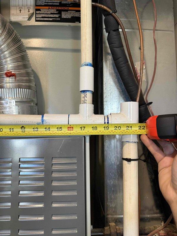 Performed technical lead estimate on complete HVAC system replacement for upstairs closet installation experiencing recurring water leakage issues. Inspected existing 2007 Trane gas furnace (Model TUDC80B9V3K4) and associated components including condensate drainage system, refrigerant lines, and ductwork. Documented equipment specifications, measured clearances, and assessed flue venting system which requires complete replacement along with new roof termination due to current system deficiencies causing moisture intrusion.