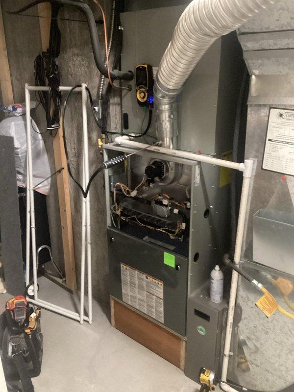 Completed fall maintenance tune-up on residential gas furnace and gas fireplace system. Performed comprehensive inspection of furnace unit, including blower motor assembly, heat exchanger, and all internal mechanical components. Verified proper operation of ignition system, burner assembly, and flame sensor. Inspected and tested safety controls, limit switches, and thermostat functionality. Cleaned blower wheel and housing to ensure optimal airflow. Checked all electrical connections and wiring for secure mounting and proper voltage. Examined ductwork connections and flexible duct routing for proper sealing and air distribution. Inspected refrigerant lines, condensate drain system, and PVC venting for proper installation and clearances. Verified furnace filter size as 20x25x5 and checked filter condition.

Performed complete inspection and cleaning of gas fireplace unit with stone surround and glass front panel. Tested gas valve operation and verified proper flame pattern across artifi