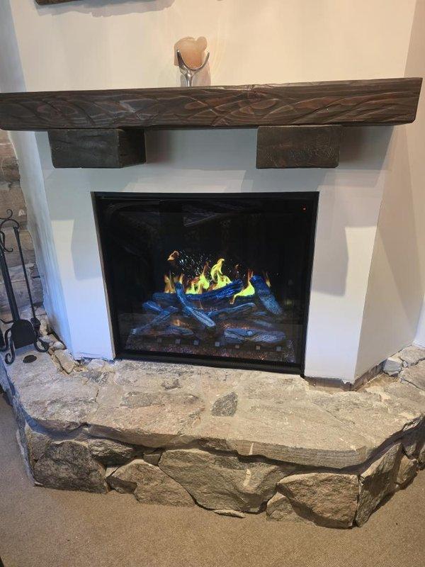 Performed cleaning and startup service on BX36 gas fireplace insert. Cleaned glass front, burner assembly, and log set to remove dust and debris accumulation. Inspected gas connections, pilot assembly, and ignition system for proper operation. Verified flame pattern and color, confirming proper combustion with characteristic yellow flames and blue accent flames on artificial log set. Tested all safety controls and confirmed unit cycling correctly. Fireplace is operating efficiently and safely.