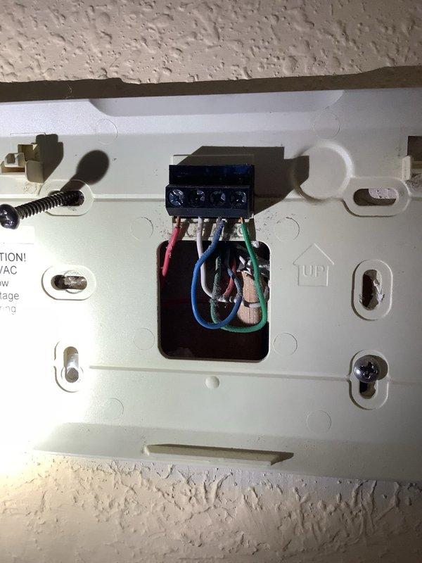 Installed Lennox iComfort S40 smart thermostat to replace existing E40 unit. Connected HVAC control wiring to new thermostat terminals, verified proper system communication, and confirmed heating operation with setpoint at 70 degrees.