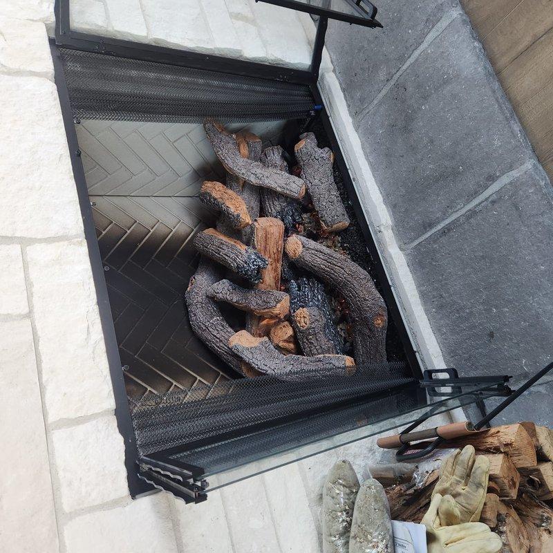 Completed recall service by returning and installing replacement log set for PH36 unit. Corrected improperly positioned front box on main floor unit and adjusted gas flow which was running below optimal levels. Verified proper operation of fireplace system with new log set installation and confirmed adequate flame presentation and heat output following gas flow adjustment.