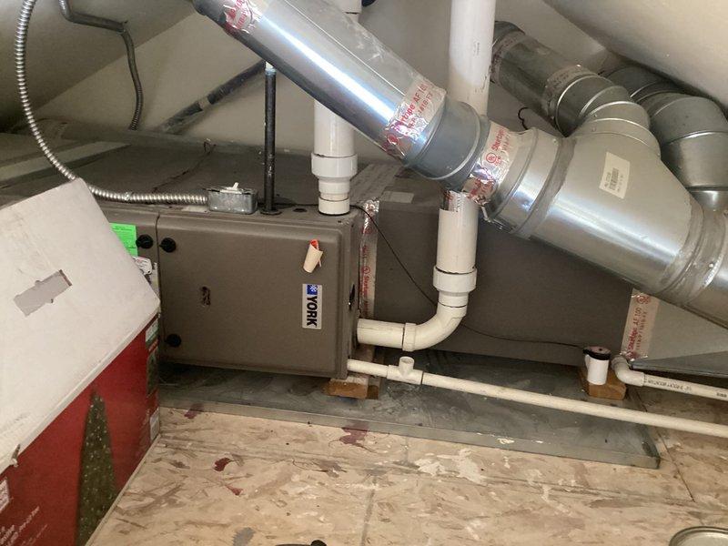 Performed a preventative maintenance tune-up on a York gas furnace over ten years old, with no reported issues prior to service. Inspected the furnace, electrical junction, PVC condensate and venting, and foil-taped supply ductwork and plenum for proper connections and condition. Verified the unit's operation and documented the system with photos; the 16x25x1 filter size was noted for the customer's replacement schedule.
