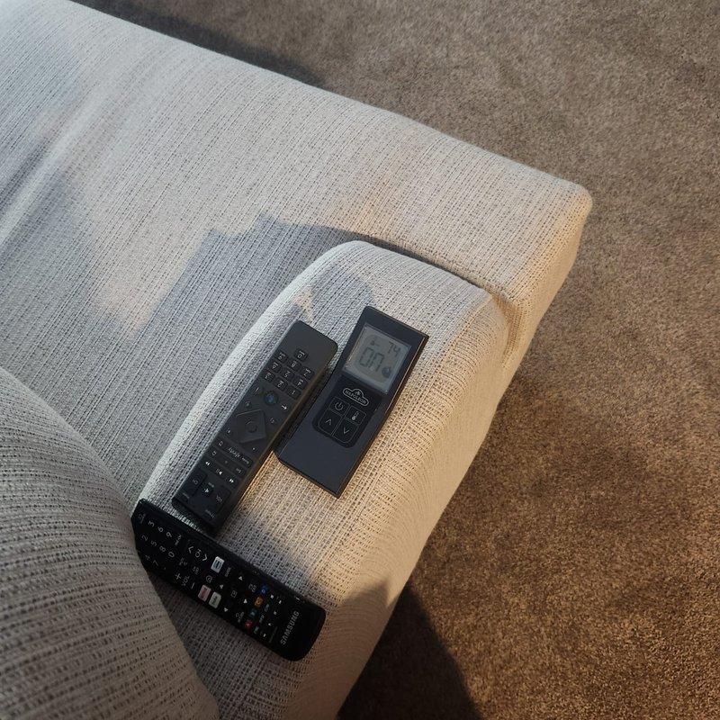 Responded to a callback for a newly installed gas fireplace that would not power on and had no remote located. Identified and paired the correct handheld transmitter using the provided receiver codes, restoring remote operation, and verified the wall-mounted switches and ignition sequence functioned properly.