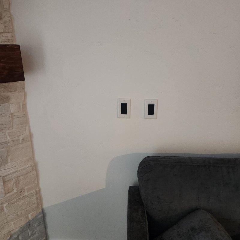 Responded to a callback for a newly installed gas fireplace that would not power on and had no remote located. Identified and paired the correct handheld transmitter using the provided receiver codes, restoring remote operation, and verified the wall-mounted switches and ignition sequence functioned properly.