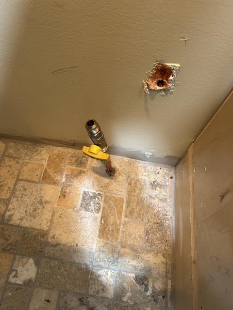 Installed gas line from existing tee under home to new shutoff behind stop. Connected stove and tested for function. Tested all connections for leaks.