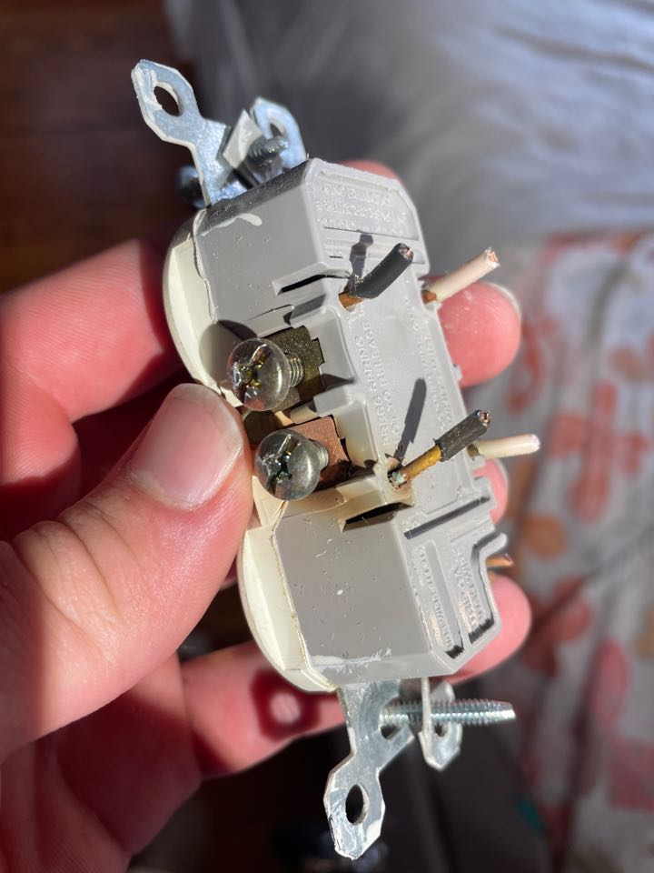 The technician diagnosed a power loss in Bedrooms 1 and 2 that was caused by a failing, backstab-wired receptacle with loose and overheating connections, unrelated to prior work. The defective outlet was replaced, circuits were relabeled in the panel, and safe, reliable power was restored.